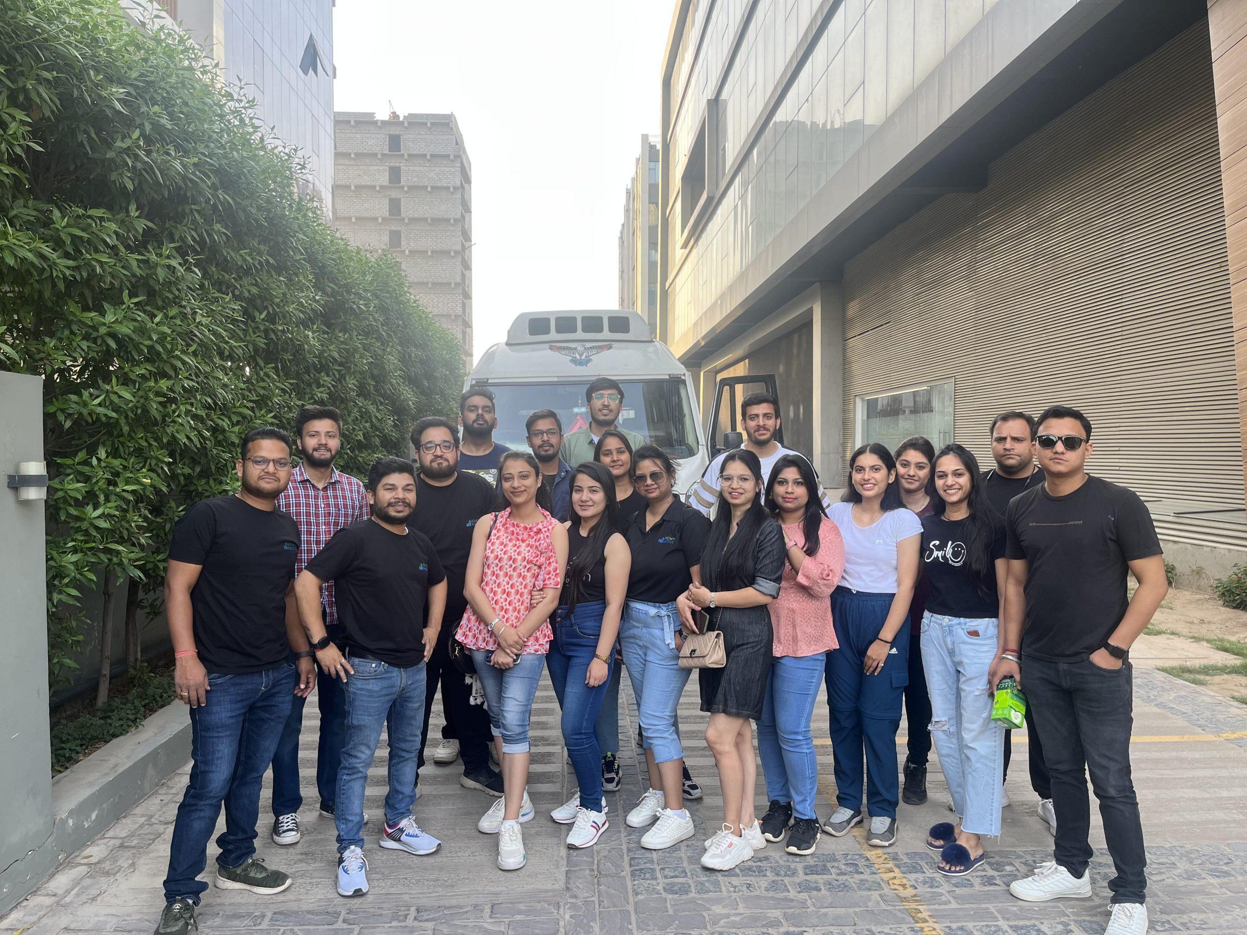 A group of people standing in front of a building.