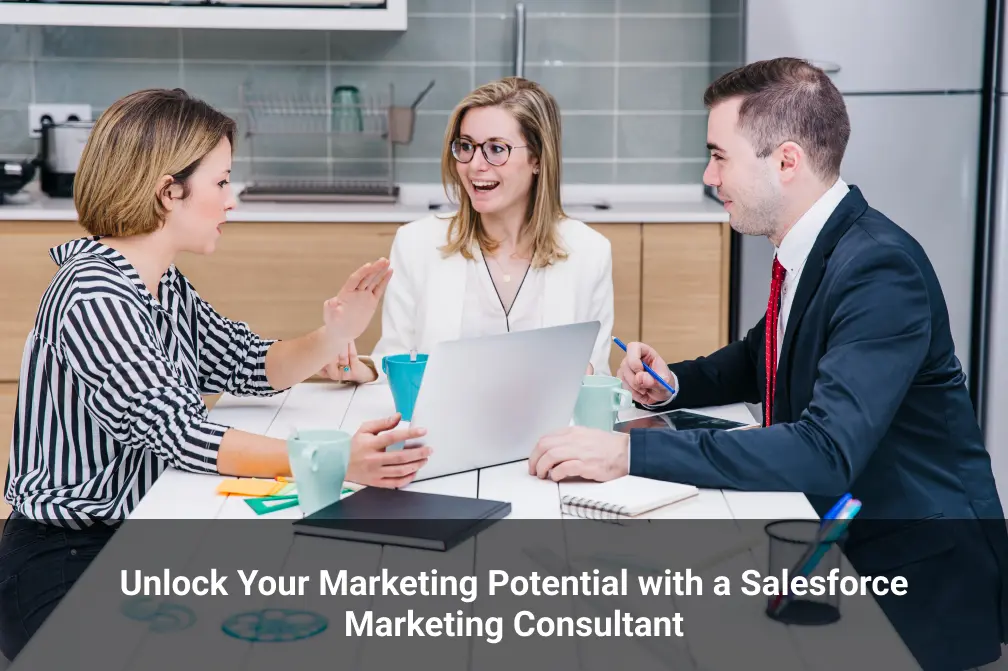 Three people sit at a table with a laptop, engaged in discussion, in a modern office. Text on image promotes Salesforce Marketing Consultant